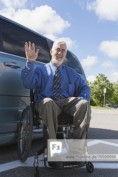 Man with muscular dystrophy and diabetes in a wheelchair near an accessible van