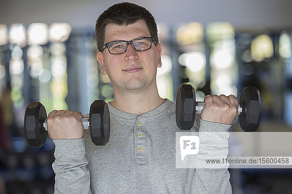 Man with Visual Impairment working out with dumbbells