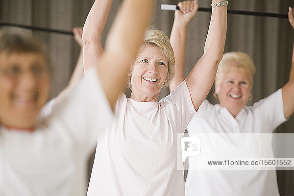 Close-up of a senior woman exercising in an exercise class