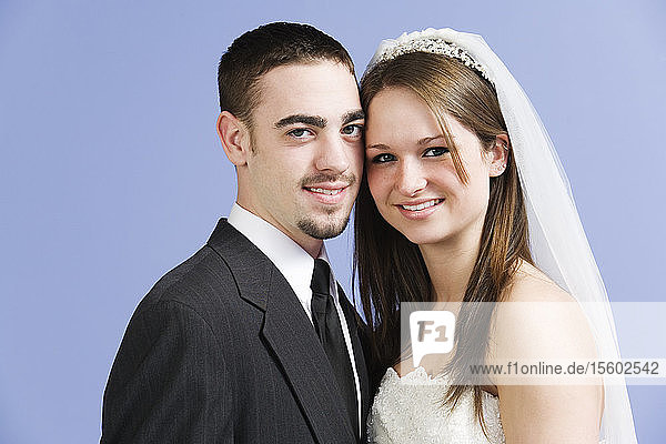 Portrait of a smiling bride and groom.
