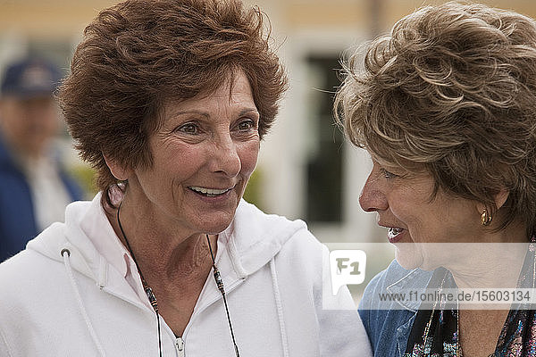Close-up of two women talking to each other
