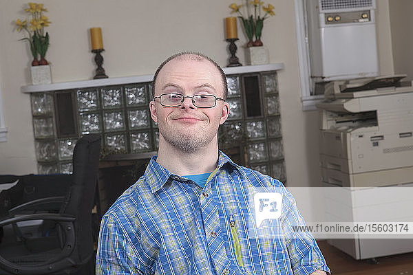 Man with Down Syndrome working in an office