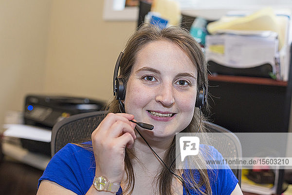 Young Woman with Cerebral Palsy wearing headset