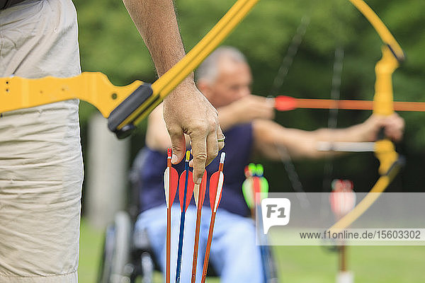 People with disabilities during archery practice