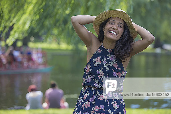 Portrait of happy Hispanic woman smiling in a park