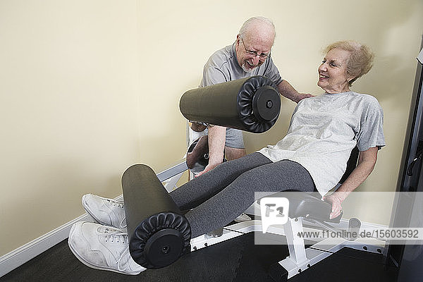 Senior couple exercising in the gym.