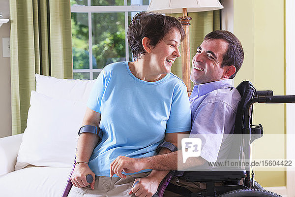 Couple with cerebral palsy sitting together
