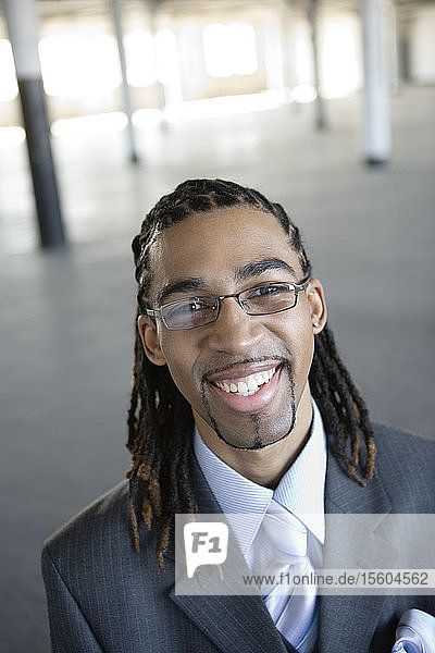 Portrait of a young business man smiling.