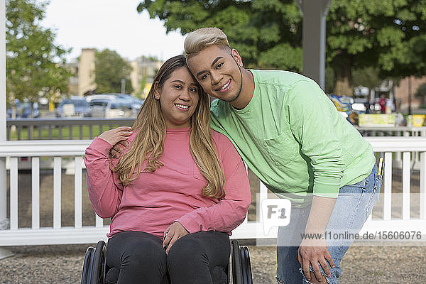 Portrait of happy friends  one with a Spinal Cord Injury