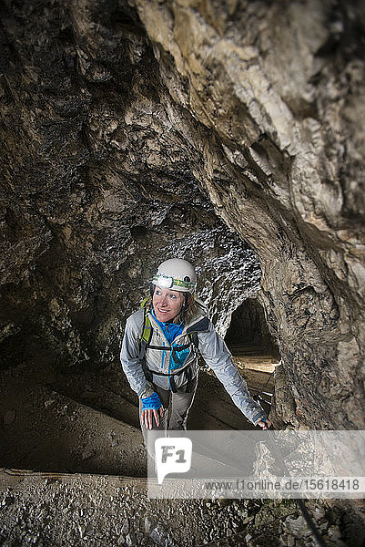 High Angle View Of Woman Hiking Through The Tunnel