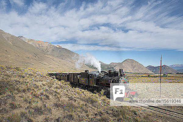 Clouds over train crossing Old Patagonian Express railway  Esquel  Chubut  Argentina
