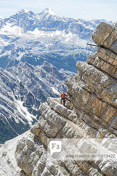 Man Climbing At The Via Ferrata Ivano Dibona In Dolomites  Italy