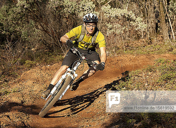 Mountain Biker riding the downhill trails on Osborn hill near Empire Mine State Park  Nevada County California