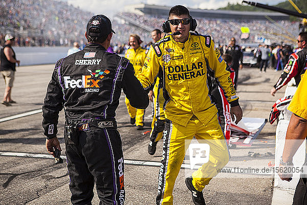 Pit crew shaking hands at the New Hampshire NASCAR 301 Sprint Cup