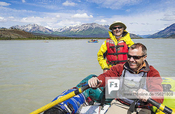 Father And Son Rafting In The Alsek River