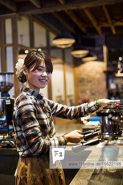 A barista at a coffee shop in Vancouver  BC  Canada.