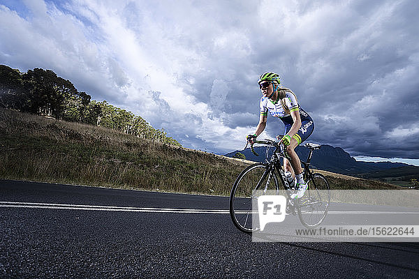 Tasmanian champion cyclist Macey Stewart out on a training ride on the country roads behind Sheffield near Mount Roland North West Tasmania.