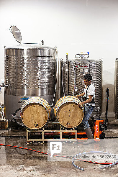 Workers checks casks for leaks before cleaning them for a new batch of wine at Delaplane Vineyards Deplane Virginia. Casks from Europe can cost over $1 600 apiece but can be used for multiple batches of wine.