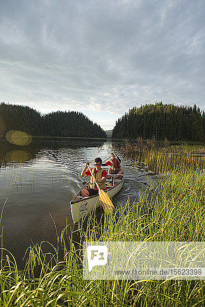 Boy Scouts canoeing on the Bowron Lakes circuit. Bowron Lakes Provincial Park. Quesnel  British Columbia