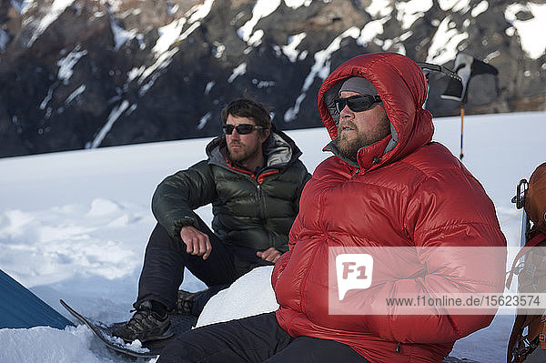 Sunny break at Camp One on the Sheep Glacier during a ski ascent of Mount Sanford in the Wrangell-St. Elias National Park outside of Glennallen  Alaska June 2011. Mount Sanford at 16 237 feet is the sixth tallest mountain in the United States. (Model Release: Patrick Gilroy and Adam Howard)