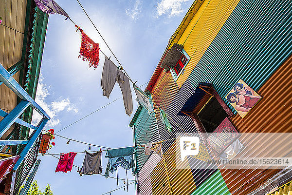 Colorful buildings and hanging laundry in the La Boca district of Buenos Aires Argentina
