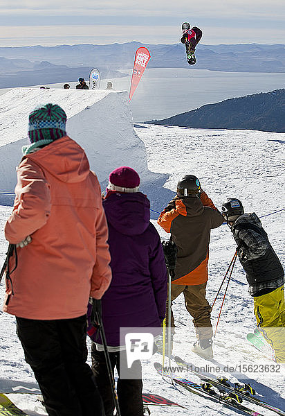 A Man Hits A Jump On His Snowboard During A Competition At Cerro Catedral In Argentina