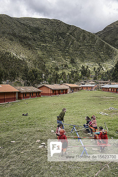 Children Playing In An Elementary School's Yard Against The Sacred Valley