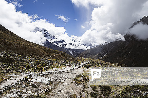 Trekkers make their way along the Pheriche Valley on Nepal's famous Everest Base Camp trek  Solu Khumbu  Nepal