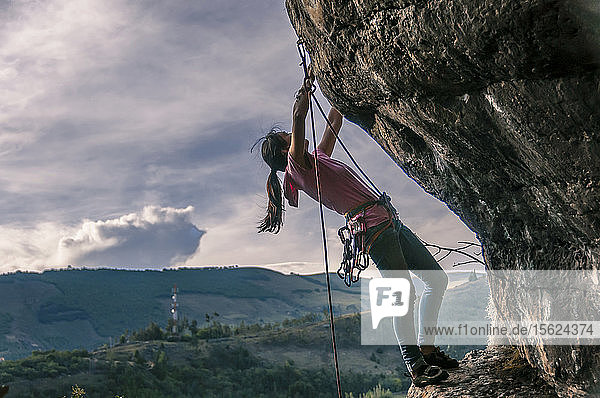 Side view of woman rock climbing  ï¾ Suesca  ï¾ Almeidasï¾ Province  ï¾ Colombia