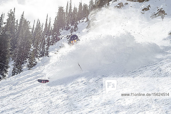 View of person backcountry skiing down hill behind powder snow  Crested Butte  Colorado  USA