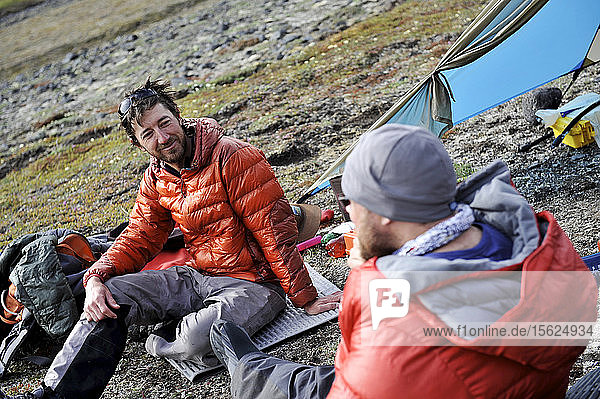Team enjoys drier climates at base camp while they wait for better wheather conditions during a ski ascent of Mount Sanford Sheep Glacier Route in the Wrangell-St. Elias National Park outside of Glennallen  Alaska June 2011. Mount Sanford at 16 237 feet is the sixth tallest mountain in the United States. (Model Release: Patrick Gilroy and Adam Howard)