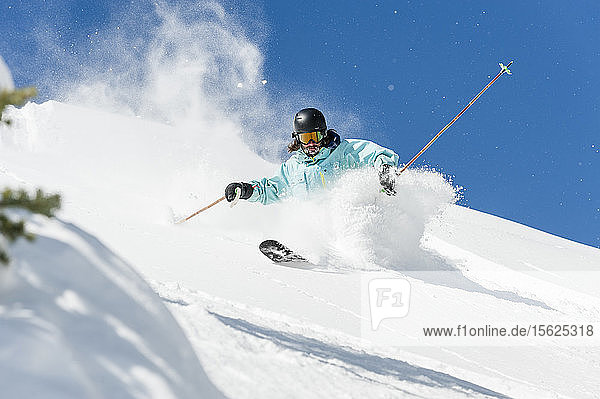 Front view shot of person backcountry skiing down hill  Crested Butte  Colorado  USA