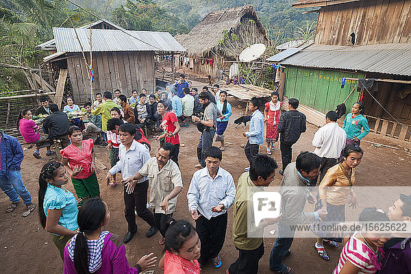 Robert Hahn  Mung  and other partygoers dance in traditional Lao style during a wedding celebration in Muang Hat Hin  Laos.