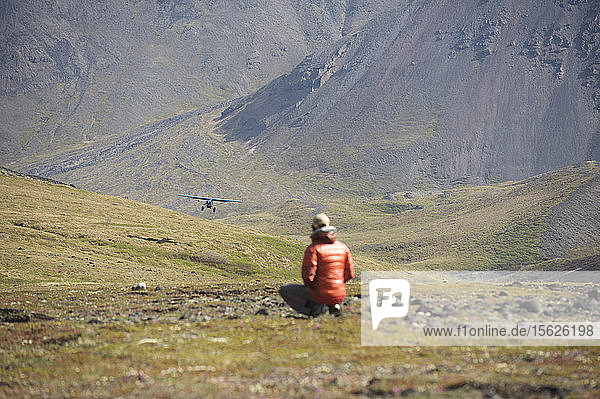 Super Cub with another team member approaches to land at base camp in the Wrangell-St. Elias National Park for a ski mountaineering ascent of the standard Sheep Glacier Route on Mount Sanford outside of Glennallen  Alaska June 2011. Mount Sanford at 16 237 feet is the sixth tallest mountain in the United States. (Model Release: Patrick Gilroy)