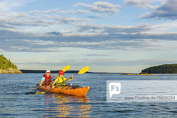 A Woman And Her Daughter Kayaking In Frenchman Bay