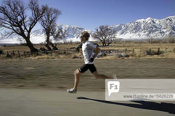 Ryan Hall  in white shirt  trains for the Olympics with Mike McKeeman  middle  and Steve Slattery  at the base of the Eastern Sierra mountains outside the town of Bishop  California about 30 miles from Mammoth Lakes. The high altitude and clean air provide a picturesque and challenging training ground for the Olympic hopeful.