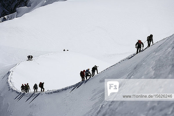 Climbers leaving Alguille du Midi for the Mont Blanc Massif  Chamonix Mont Blanc  France
