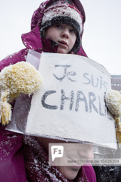 Demonstration in the snow storm at Sergels torg in Stockholm where thousands of people come to listen to French ambassador for freedom of speech and against the terrorist attack in Paris France.