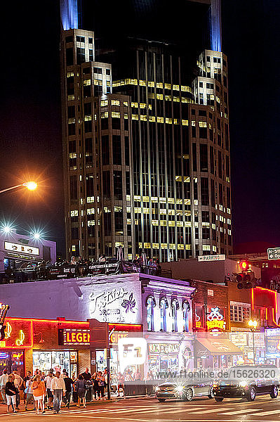 Night cityscape with ATT Batman Building and Broadway  Nashville  Tennessee  USA