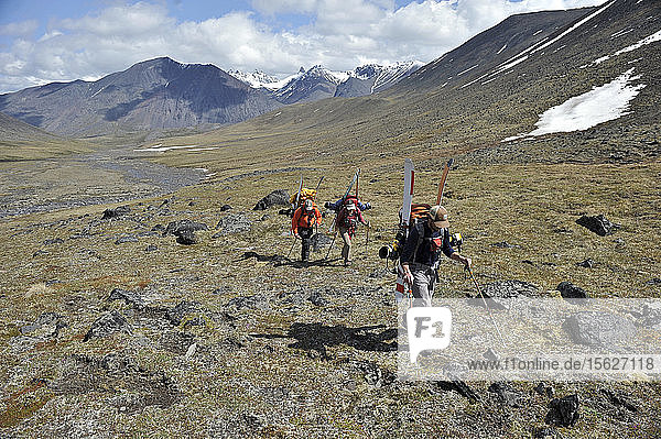 Skiers haul a cache to Camp One on the Sheep Glacier in preparation for a ski ascents of Mount Sanford in the Wrangell-St. Elias National Park outside of Glennallen  Alaska June 2011. Mount Sanford at 16 237 feet is the sixth tallest mountain in the United States. (Model Release: Patrick Gilroy  Adam Howard and Agnes Hage)