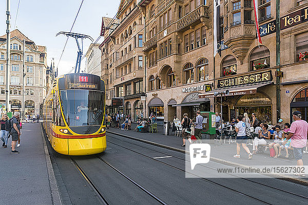 Crowded city street with tram station at Marktplatz  Basel  Switzerland