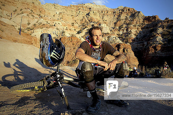 Mountain Biker at Red Bull Rampage sitting at sunset  Utah  USA