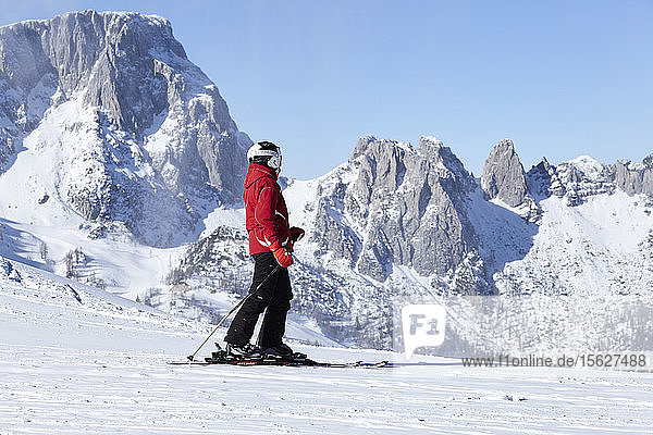 Skier standing in ski mountain resort