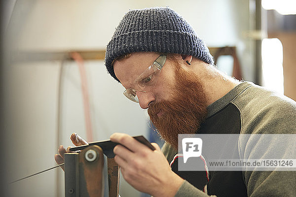 Man making knives in a workshop