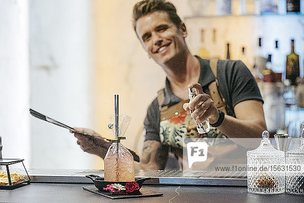 Bartender mixing cocktail in a bar  cocktail in a pouch