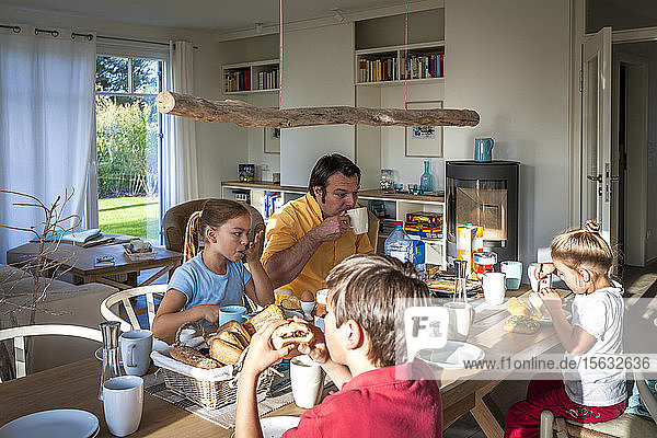 Family having breakfast at dining table