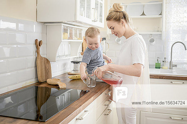 Mother with her little boy in the kitchen