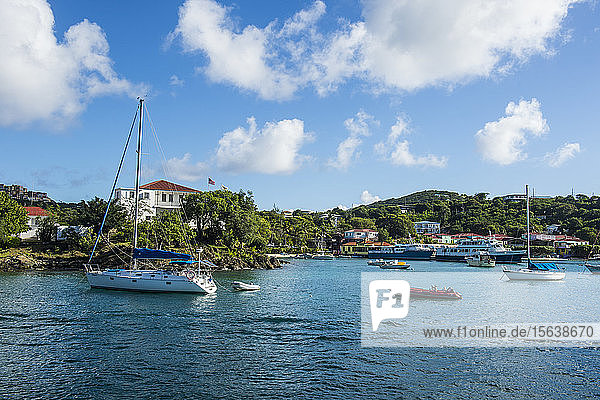 Boats on sea at Cruz bay against sky at Virgin Islands National Park USA