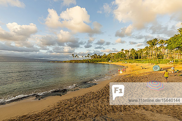 Tourists enjoying Kapalua Beach at sunset; Ka'anapali  Maui  Hawaii  United States of America