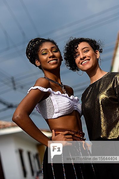 Two smiling young latin women  Cali  Colombia  South America
